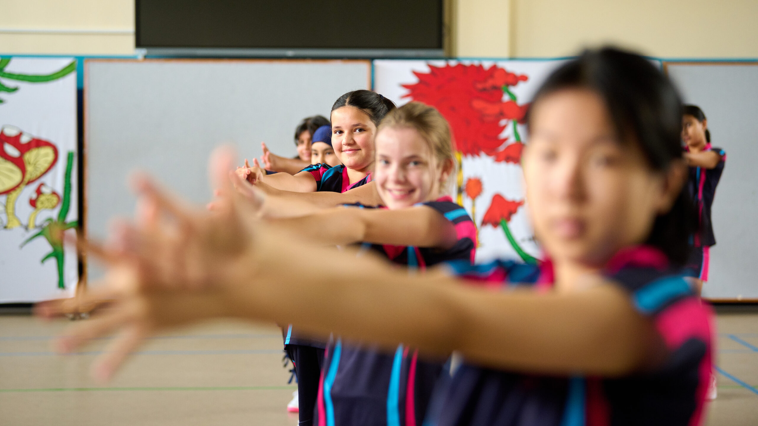 girls in sports clothes stretching