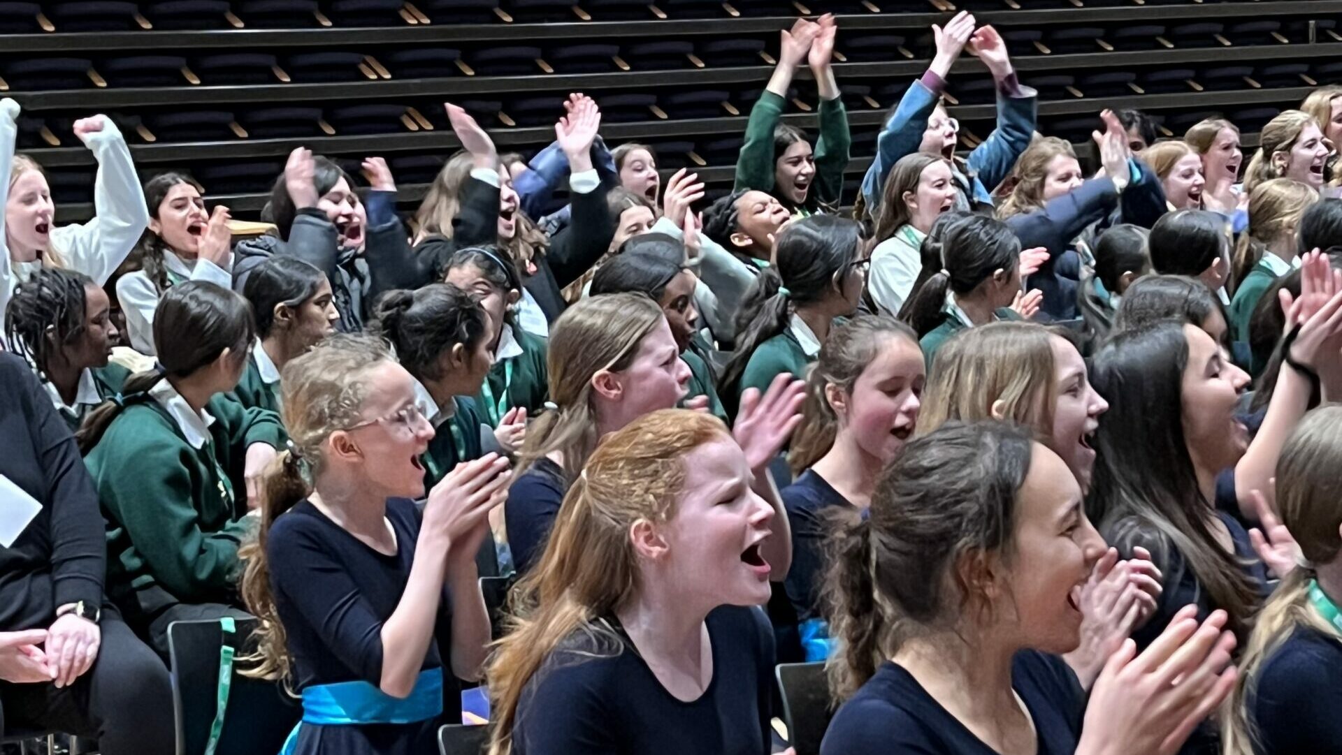 Junior and Senior choirs singing and having fun during the Massed Performance at the GSA Choir of the Year Final