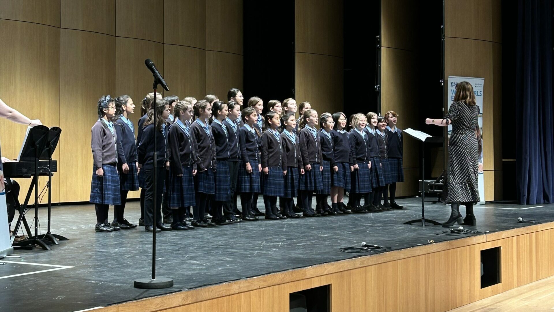 Headington School's choir performing for the Juniors at GSA's Choir of the Year 2023 event
